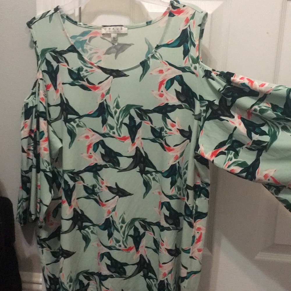 A light green blouse with pink flowers